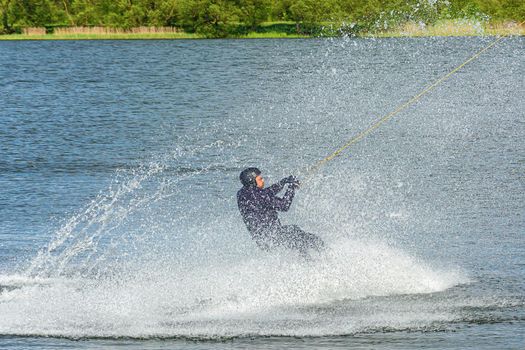 Belarus, Minsk - May 23, 2021: Sports. The kitesurfer splashed down on the surface of the water with large splashes. Stock photography.