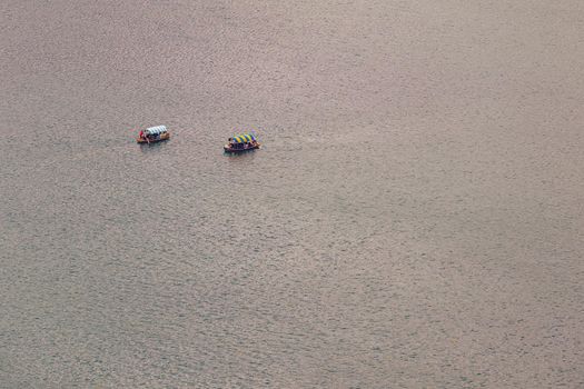 Lake Bled, Slovenia. Top view of a boat sailing in the lake. Bled lake is the most famous lake in Slovenia. Bled, Slovenia.