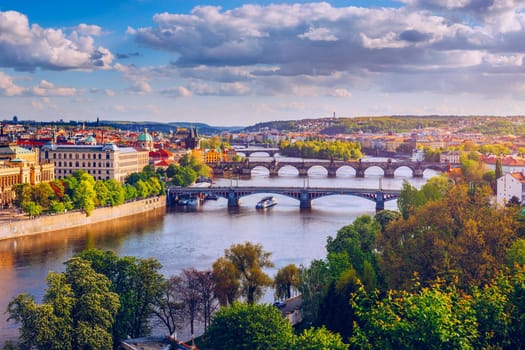 Autumn view to Charles bridge on Vltava river in Prague, Czech Republic. Autumn view to Charles Bridge, Prague old town and Vltava river from popular view point in the Letna park (Letenske sady).