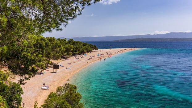 Zlatni Rat (Golden Cape or Golden Horn) famous turquoise beach in Bol town on Brac island, Dalmatia, Croatia. Zlatni Rat sandy beach at Bol on Brac island of Croatia in summertime.
