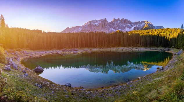 Carezza lake (Lago di Carezza, Karersee) with Mount Latemar, Bolzano province, South tyrol, Italy. Landscape of Lake Carezza or Karersee and Dolomites in background, Nova Levante, Bolzano, Italy.