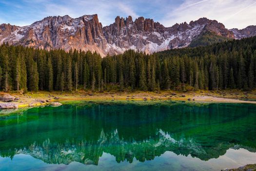 Carezza lake (Lago di Carezza, Karersee) with Mount Latemar, Bolzano province, South tyrol, Italy. Landscape of Lake Carezza or Karersee and Dolomites in background, Nova Levante, Bolzano, Italy.