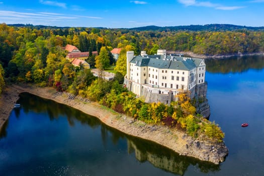 Aerial view chateau Orlik, above Orlik reservoir in beautiful autumn nature. Romantic royal Schwarzenberg castle above water level. Czechia. Orlik castle across the River Vltava, Czech Republic.