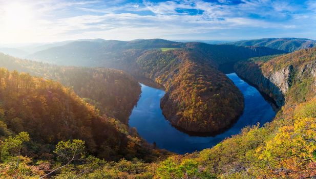 Beautiful Vyhlidka Maj, Lookout Maj, near Teletin, Czech Republic. Meander of the river Vltava surrounded by colorful autumn forest viewed from above. Tourist attraction in Czech landscape. Czechia.