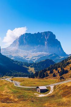 Gardena Pass, Trentino Alto Adige, Italy. Gardena Pass with Sassolungo mountain on the background. Passo Gardena, alpine pass between Val Badia and Val Gardena, South Tyrol, Italy.