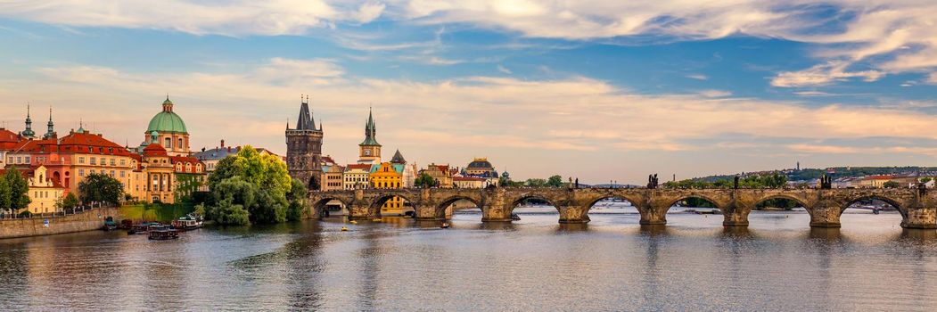 Scenic view on Vltava river and historical center of Prague, buildings and landmarks of old town, Prague, Czech Republic. Charles Bridge (Karluv Most) and Lesser Town Tower, Prague, Czechia