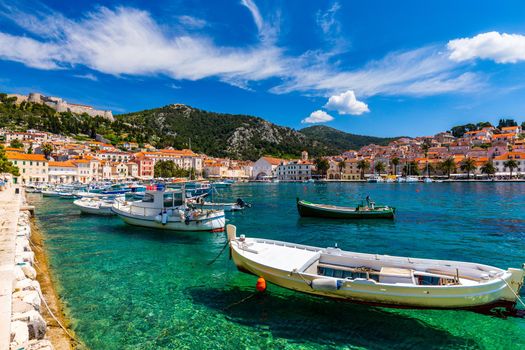 View at amazing archipelago with boats in front of town Hvar, Croatia. Harbor of old Adriatic island town Hvar. Popular touristic destination of Croatia. Amazing Hvar city on Hvar island, Croatia. 