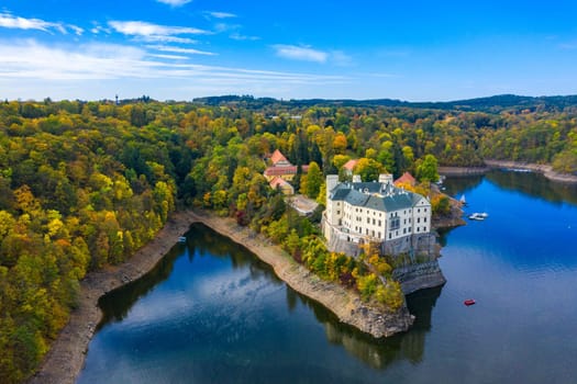 Aerial view chateau Orlik, above Orlik reservoir in beautiful autumn nature. Romantic royal Schwarzenberg castle above water level. Czechia. Orlik castle across the River Vltava, Czech Republic.