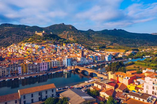 Aerial view of the beautiful village of Bosa with colored houses and a medieval castle. Bosa is located in the north-wesh of Sardinia, Italy. Aerial view of colorful houses in Bosa village, Sardegna.