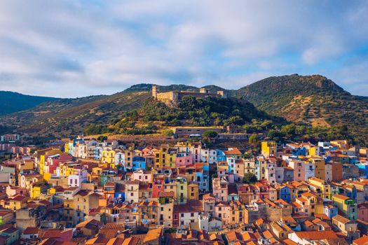 Aerial view of the beautiful village of Bosa with colored houses and a medieval castle. Bosa is located in the north-wesh of Sardinia, Italy. Aerial view of colorful houses in Bosa village, Sardegna.