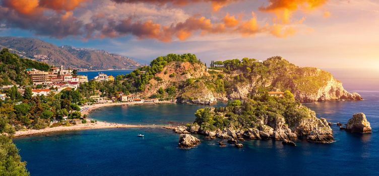 Aerial view of Isola Bella in Taormina, Sicily, Italy. Isola Bella is small island near Taormina, Sicily, Italy. Narrow path connects island to mainland Taormina beach in azure waters of Ionian Sea. 