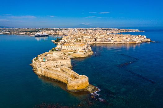 Siracusa, Ortigia Island from the air, Sicily, Italy. Isola di Ortigia, coast of Ortigia island at city of Syracuse, Sicily, Italy. Coastline town Syracuse, Sicily and old Ortigia island. Aerial view.