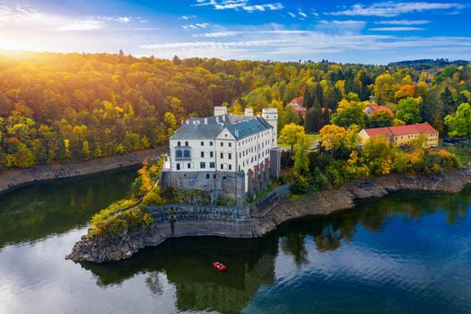 Aerial view chateau Orlik, above Orlik reservoir in beautiful autumn nature. Romantic royal Schwarzenberg castle above water level. Czechia. Orlik castle across the River Vltava, Czech Republic.