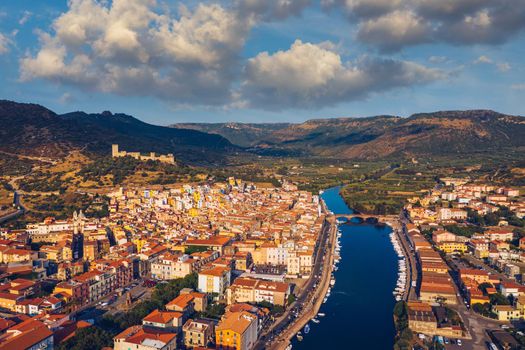 Aerial view of the beautiful village of Bosa with colored houses and a medieval castle. Bosa is located in the north-wesh of Sardinia, Italy. Aerial view of colorful houses in Bosa village, Sardegna.