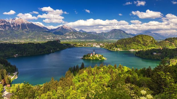 Lake Bled Slovenia. Beautiful mountain lake with small Pilgrimage Church. Most famous Slovenian lake and island Bled with Pilgrimage Church of the Assumption of Maria. Bled, Slovenia, Europe. 