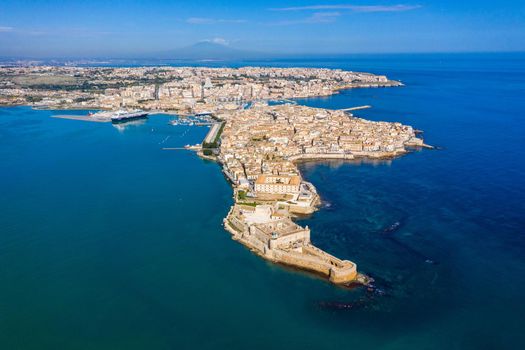 Siracusa, Ortigia Island from the air, Sicily, Italy. Isola di Ortigia, coast of Ortigia island at city of Syracuse, Sicily, Italy. Coastline town Syracuse, Sicily and old Ortigia island. Aerial view.