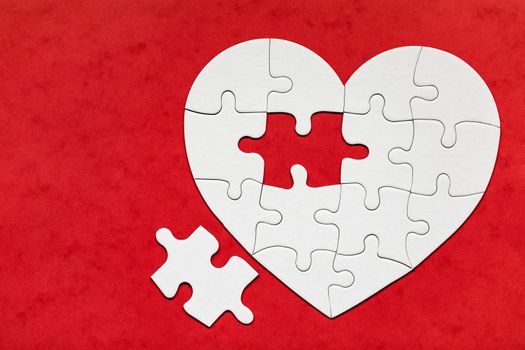 Heart object made of puzzle pieces. Make complete heart. Jigsaw puzzle pieces in form of heart. Happy Valentines Day, greeting card template. Heart jigsaw puzzle.
