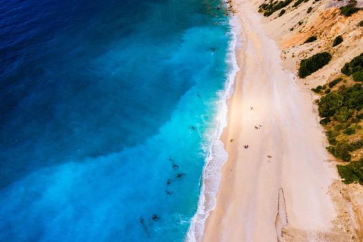 Aerial drone view of iconic turquoise and sapphire bay and beach of Myrtos, Kefalonia (Cephalonia) island, Ionian, Greece. Myrtos beach, Kefalonia island, Greece. Beautiful view of Myrtos beach.