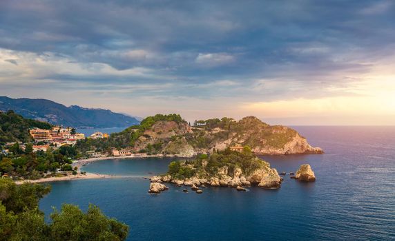 Aerial view of Isola Bella in Taormina, Sicily, Italy. Isola Bella is small island near Taormina, Sicily, Italy. Narrow path connects island to mainland Taormina beach in azure waters of Ionian Sea. 
