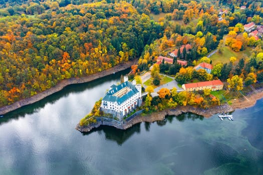Aerial view chateau Orlik, above Orlik reservoir in beautiful autumn nature. Romantic royal Schwarzenberg castle above water level. Czechia. Orlik castle across the River Vltava, Czech Republic.