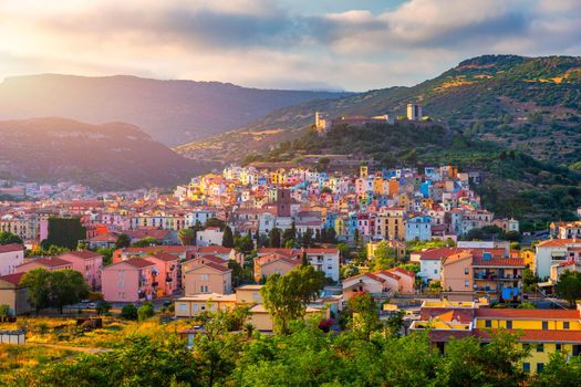 Aerial view of the beautiful village of Bosa with colored houses and a medieval castle. Bosa is located in the north-wesh of Sardinia, Italy. Aerial view of colorful houses in Bosa village, Sardegna.