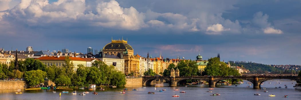 Prague in a sunny day, view of the old town, Prague, Czech Republic. Scenic summer view of the Old Town pier architecture and Charles Bridge over Vltava river in Prague, Czech Republic