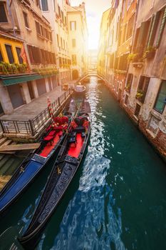 Canal with gondolas in Venice, Italy. Architecture and landmarks of Venice. Venice postcard with Venice gondolas.