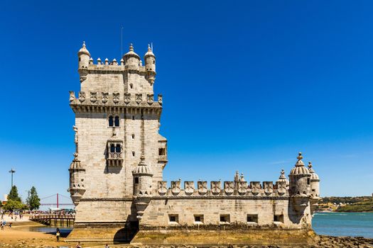 View at the Belem tower at the bank of Tejo River in Lisbon, Portugal. The Belem Tower (Torre de Belem), Lisbon, Portugal. At the margins of the Tejo river, it is an iconic site of the city. 