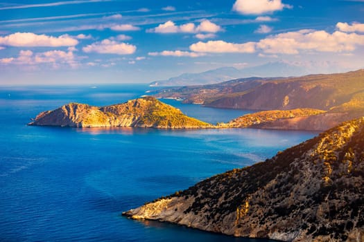 Assos village in Kefalonia, Greece. Turquoise colored bay in Mediterranean sea with beautiful colorful houses in Assos village in Kefalonia, Greece, Ionian island, Cephalonia, Assos village.