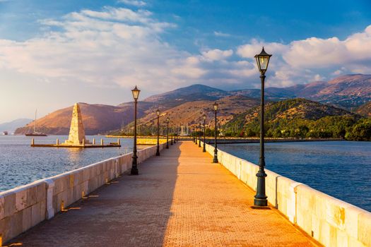 View of the De Bosset Bridge in Argostoli city on Kefalonia island. De Bosset Bridge on lakeside In Argostoli, Kefalonia. Obelisk and the de Bosset bridge in Argostoli, Kefalonia, Greece