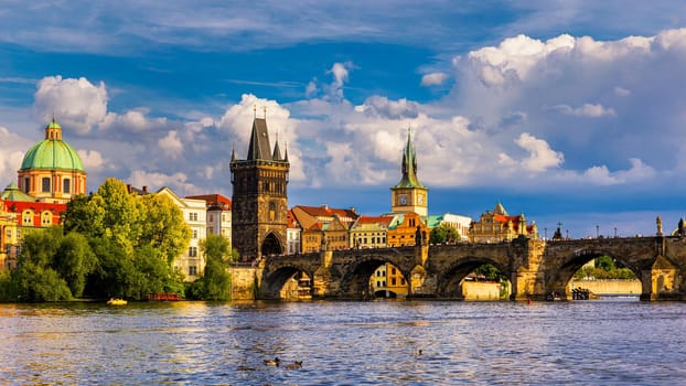 Prague in a sunny day, view of the old town, Prague, Czech Republic. Scenic summer view of the Old Town pier architecture and Charles Bridge over Vltava river in Prague, Czech Republic