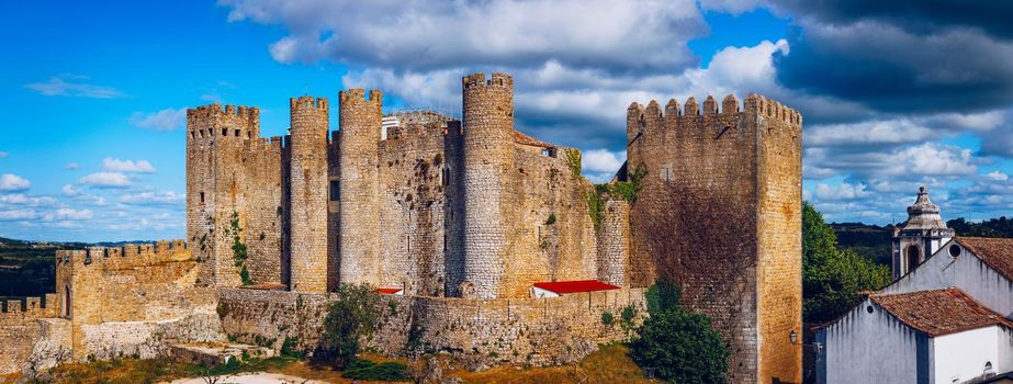 Obidos, Portugal stonewalled city with medieval fortress, historic walled town of Obidos, near Lisbon, Portugal. Beautiful view of Obidos Medieval Town, Portugal. 