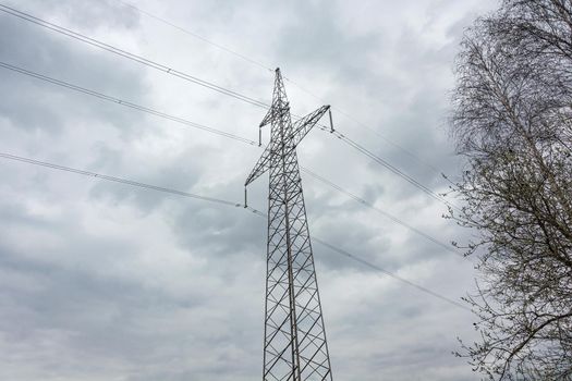 Industry. Support mast and high-voltage power line. Stock photo.