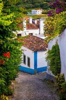 Obidos, Portugal stonewalled city with medieval fortress, historic walled town of Obidos, near Lisbon, Portugal. Beautiful view of Obidos Medieval Town, Portugal. 