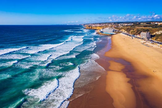 Praia Grande, Portugal. Beautiful sunset in the portuguese beach Praia Grande, in Portugal. Beach of Praia Grande. View of Atlantic beach and big waves. Colares, Sintra, Portugal. 