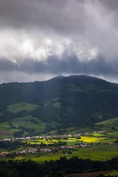 Azores panoramic view of natural landscape, wonderful scenic island of Portugal. Beautiful lagoons in volcanic craters and green fields. Tourist attraction and travel destination. Azores, Portugal.