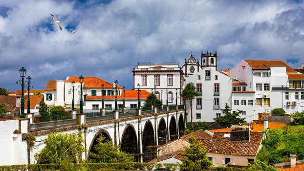 View of Nordeste on Sao Miguel Island, Azores. Old stone arch bridge in Nordeste village, Sao Miguel, Azores. Nordeste village with white town buildings on the island of Sao Miguel, Azores, Portugal.