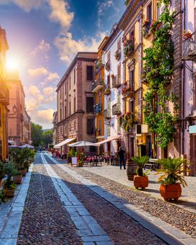 Street view of the beautiful village of Bosa with colored houses and a medieval castle. Bosa is located in the north-wesh of Sardinia, Italy. Street view of colorful houses in Bosa village, Sardegna.