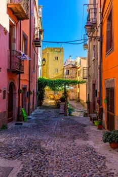 Street view of the beautiful village of Bosa with colored houses and a medieval castle. Bosa is located in the north-wesh of Sardinia, Italy. Street view of colorful houses in Bosa village, Sardegna.