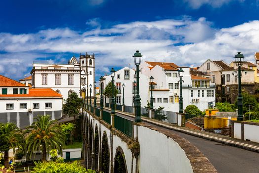 View of Nordeste on Sao Miguel Island, Azores. Old stone arch bridge in Nordeste village, Sao Miguel, Azores. Nordeste village with white town buildings on the island of Sao Miguel, Azores, Portugal.