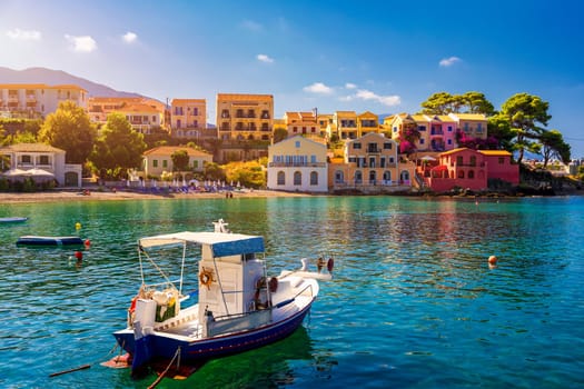 Assos village in Kefalonia, Greece. Turquoise colored bay in Mediterranean sea with beautiful colorful houses in Assos village in Kefalonia, Greece, Ionian island, Cephalonia, Assos village.