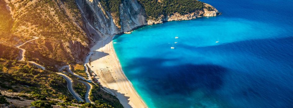 Aerial drone view of iconic turquoise and sapphire bay and beach of Myrtos, Kefalonia (Cephalonia) island, Ionian, Greece. Myrtos beach, Kefalonia island, Greece. Beautiful view of Myrtos beach.