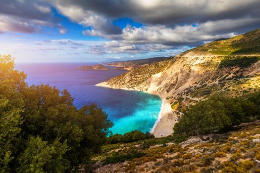 Aerial drone view of iconic turquoise and sapphire bay and beach of Myrtos, Kefalonia (Cephalonia) island, Ionian, Greece. Myrtos beach, Kefalonia island, Greece. Beautiful view of Myrtos beach.