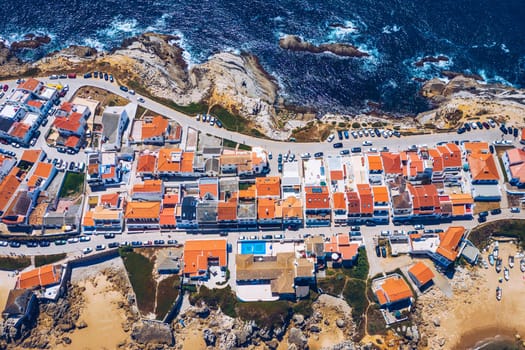 Aerial view of island Baleal naer Peniche on the shore of the ocean in west coast of Portugal. Baleal Portugal with incredible beach and surfers. Aerial view of Baleal, Portugal.
