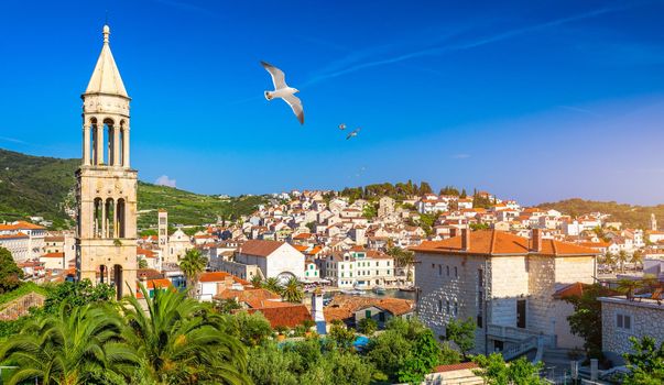 View at amazing archipelago in front of town Hvar, Croatia with seagull's flying over the city. Harbor of old Adriatic island town Hvar. Amazing Hvar city on Hvar island, Croatia. 