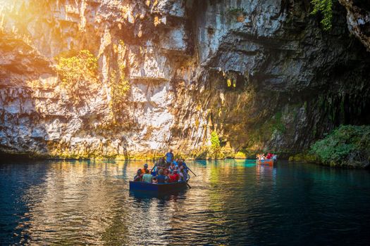 Melissani lake on Kefalonia island, Greece. Melissani Cave (Melissani Lake) near Sami village in Kefalonia island, Greece. Tourist boat on the lake in Melissani Cave, Kefalonia Island, Greece