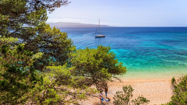 Zlatni Rat (Golden Cape or Golden Horn) famous turquoise beach in Bol town on Brac island, Dalmatia, Croatia. Zlatni Rat sandy beach at Bol on Brac island of Croatia in summertime.