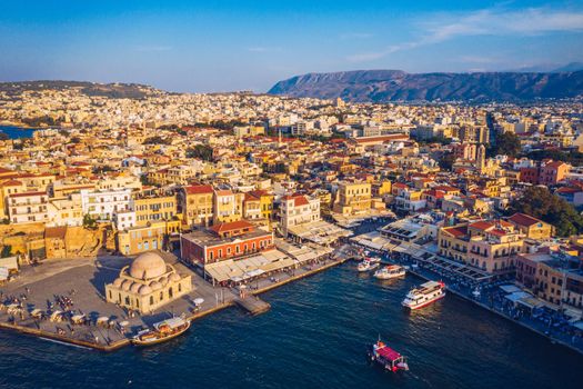 Picturesque old port of Chania. Landmarks of Crete island. Greece. Aerial view of the beautiful city of Chania with it's old harbor and the famous lighthouse, Crete, Greece.