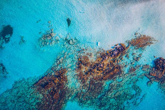Aerial view of beautiful tropical Elafonissi Beach with pink sand. View of a nice tropical Elafonissi beach from the air. Beautiful sky, sea, resort. Elafonissi beach, Crete, Greece.