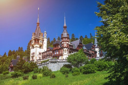 Peles Castle, Romania. Beautiful famous royal castle and ornamental garden in Sinaia landmark of Carpathian Mountains in Europe